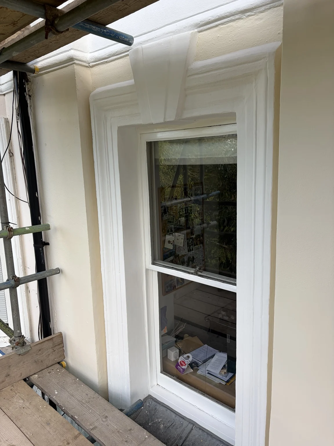 Decorated window surround and architectural mouldings in Notting Hill